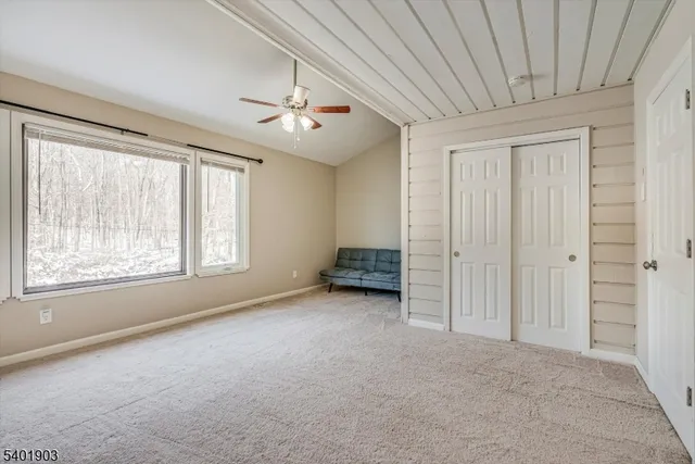 a bed room with a bed and a chandelier