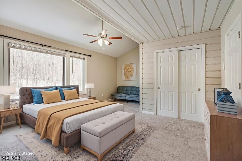 223 Cherokee Road Lafayette, NJ 07848 - Photo 20 of 36 a bed room with a bed and a chandelier