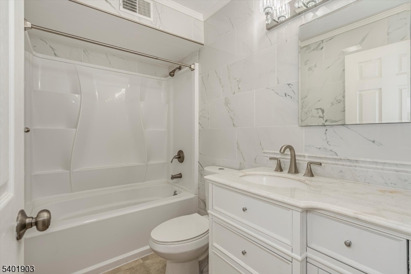223 Cherokee Road Lafayette, NJ 07848 - Photo 24 of 36 a bathroom with a sink a toilet and a bathtub