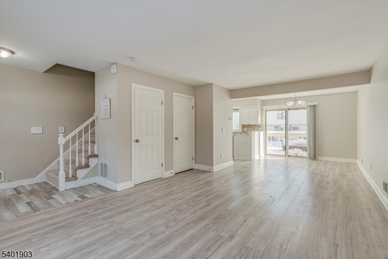 223 Cherokee Road Lafayette, NJ 07848 - Photo 6 of 36 a view of an empty room with wooden floor and a window
