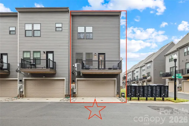 a house with street next to a road