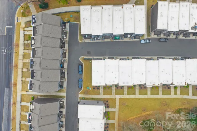 a view of a patio with table and chairs with wooden floor and fence