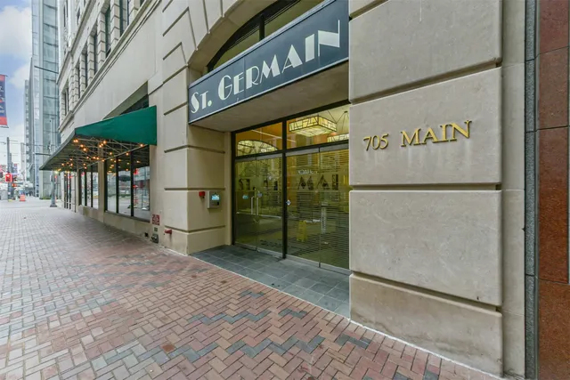 a view of a street with a building entrance