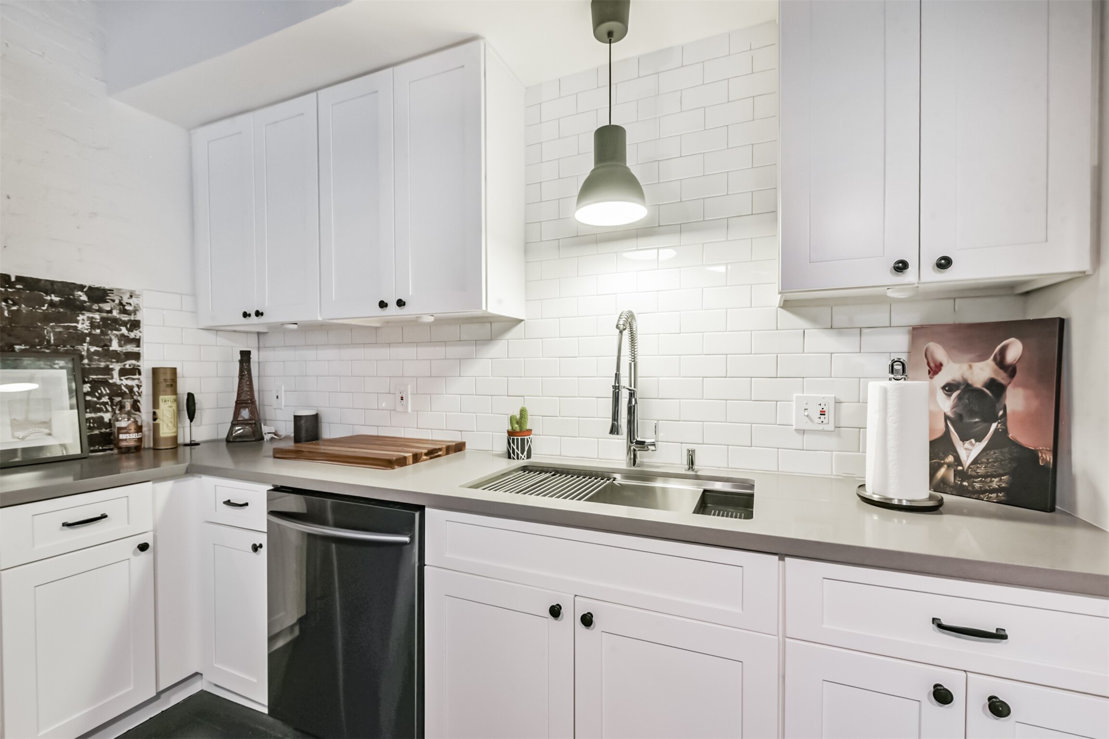 705 Main Street, Unit 321 Houston, TX 77002 - Photo 27 of 39 a kitchen with stainless steel appliances granite countertop a sink a stove and white cabinets