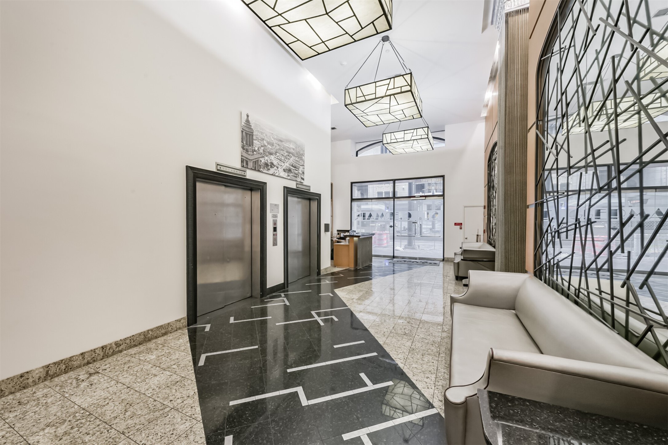 705 Main Street, Unit 321 Houston, TX 77002 - Photo 4 of 39 a living room with furniture and a chandelier