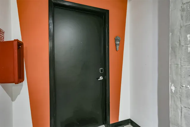 a bedroom with a bed and a table