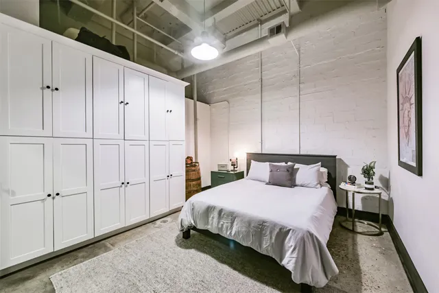 a bedroom with a bed and a television