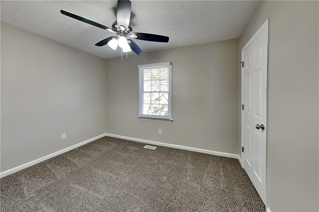 3094 Calumet Circle Northwest Kennesaw, GA 30152 - Photo 11 of 23 a view of an empty room with a window