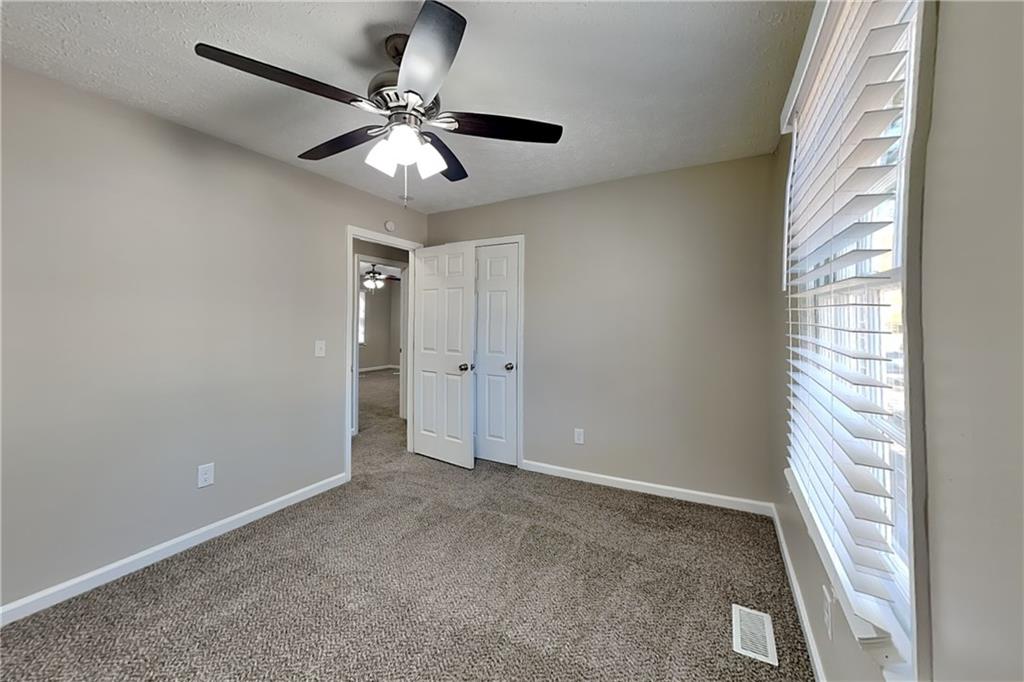 3094 Calumet Circle Northwest Kennesaw, GA 30152 - Photo 13 of 23 en view of an empty room and chandelier fan
