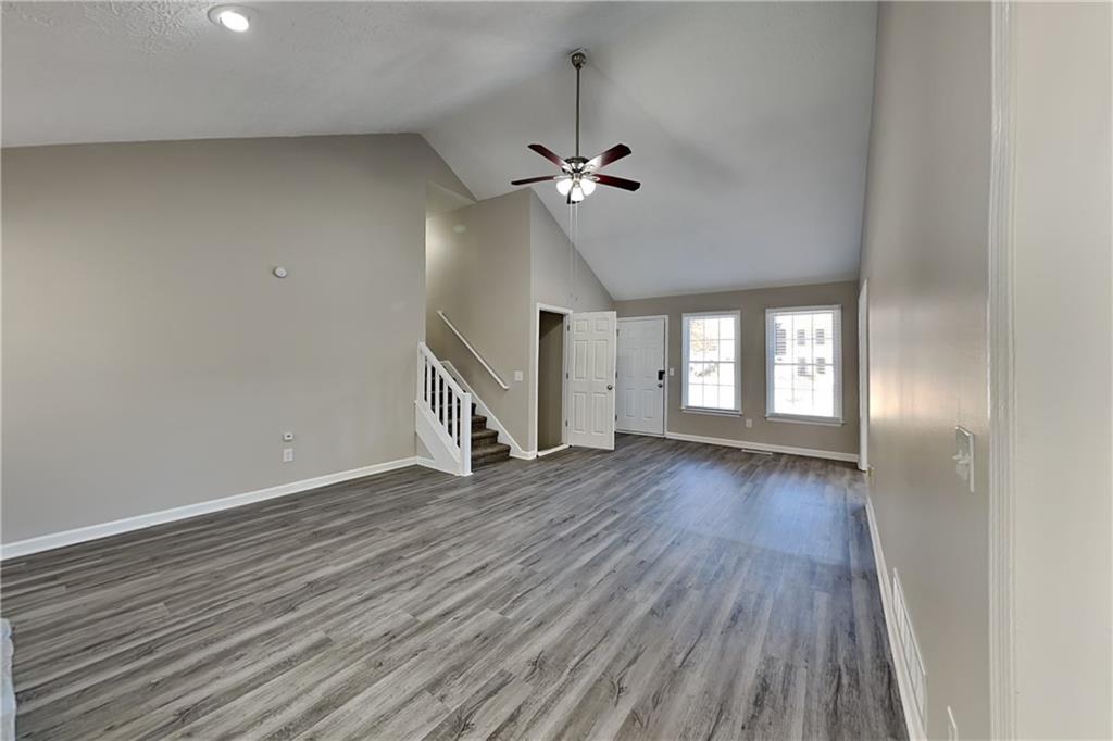3094 Calumet Circle Northwest Kennesaw, GA 30152 - Photo 3 of 23 wooden floor in an empty room with a window