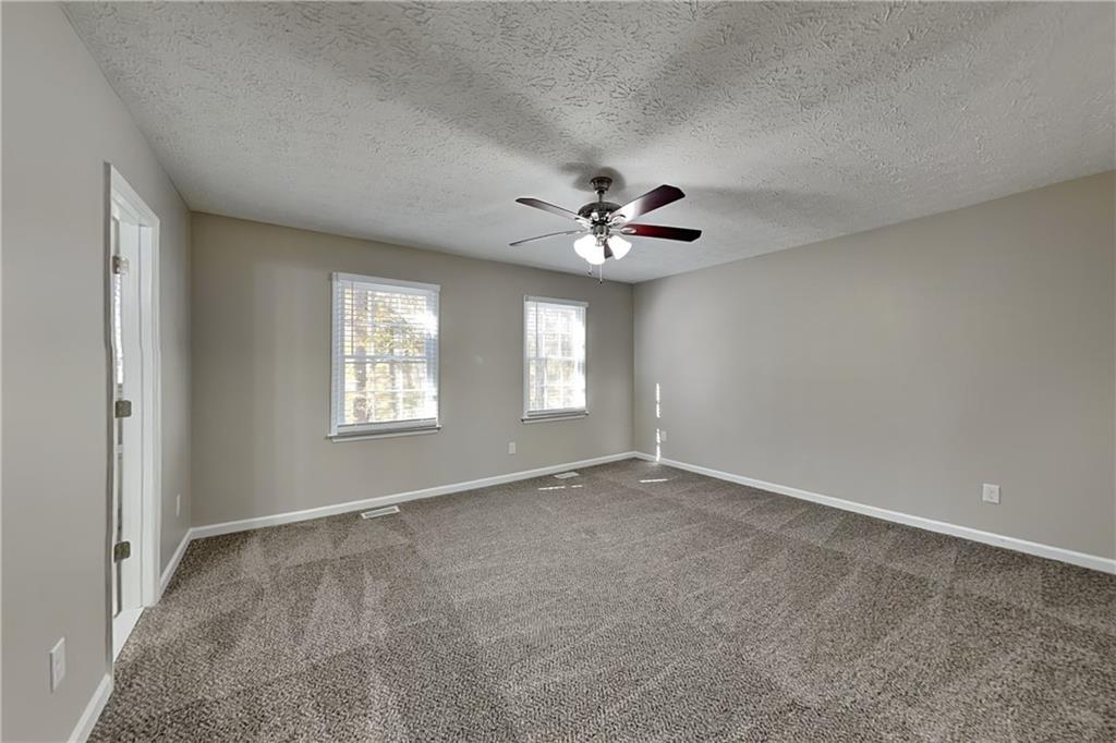 3094 Calumet Circle Northwest Kennesaw, GA 30152 - Photo 8 of 23 a view of an empty room with a window