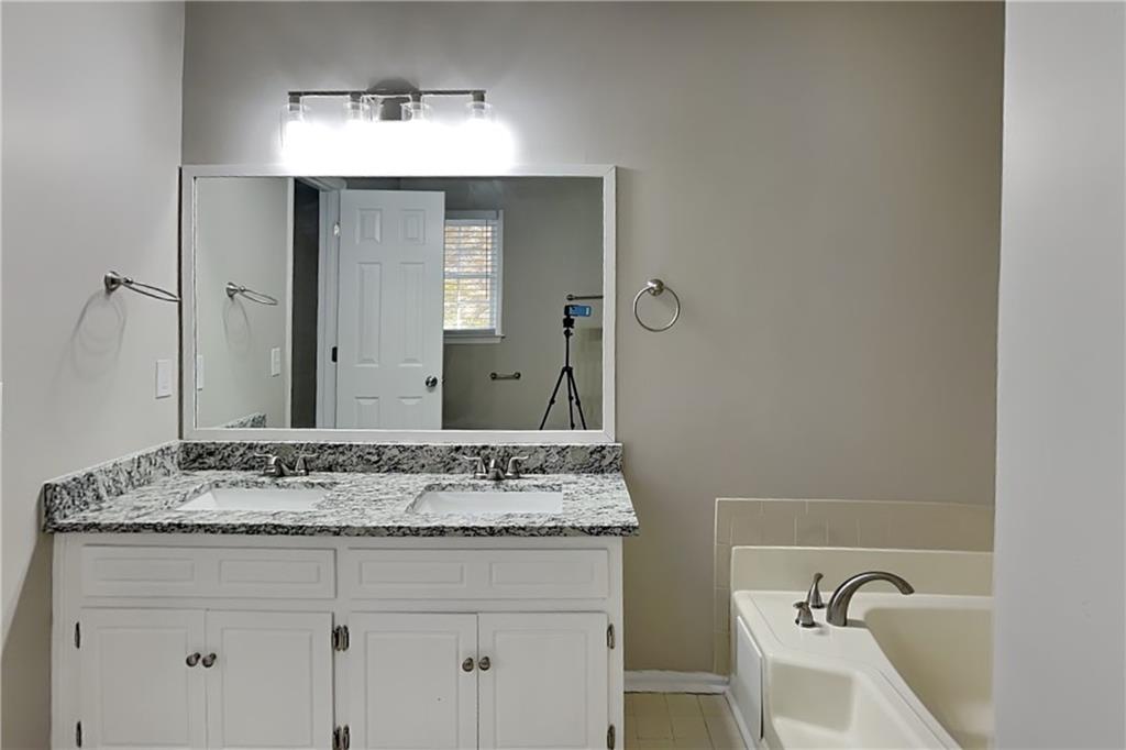 3094 Calumet Circle Northwest Kennesaw, GA 30152 - Photo 9 of 23 a bathroom with a sink and a mirror