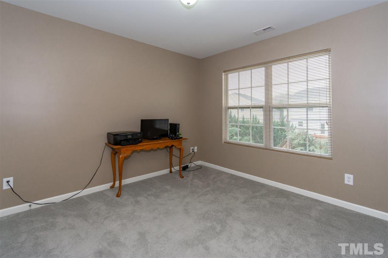1640 Extine Lane Raleigh, NC 27610 - Photo 22 of 28 a room with furniture and a window