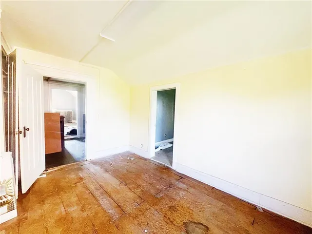 a kitchen with stainless steel appliances a stove a sink and white cabinets