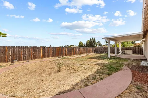 a view of a backyard of the house