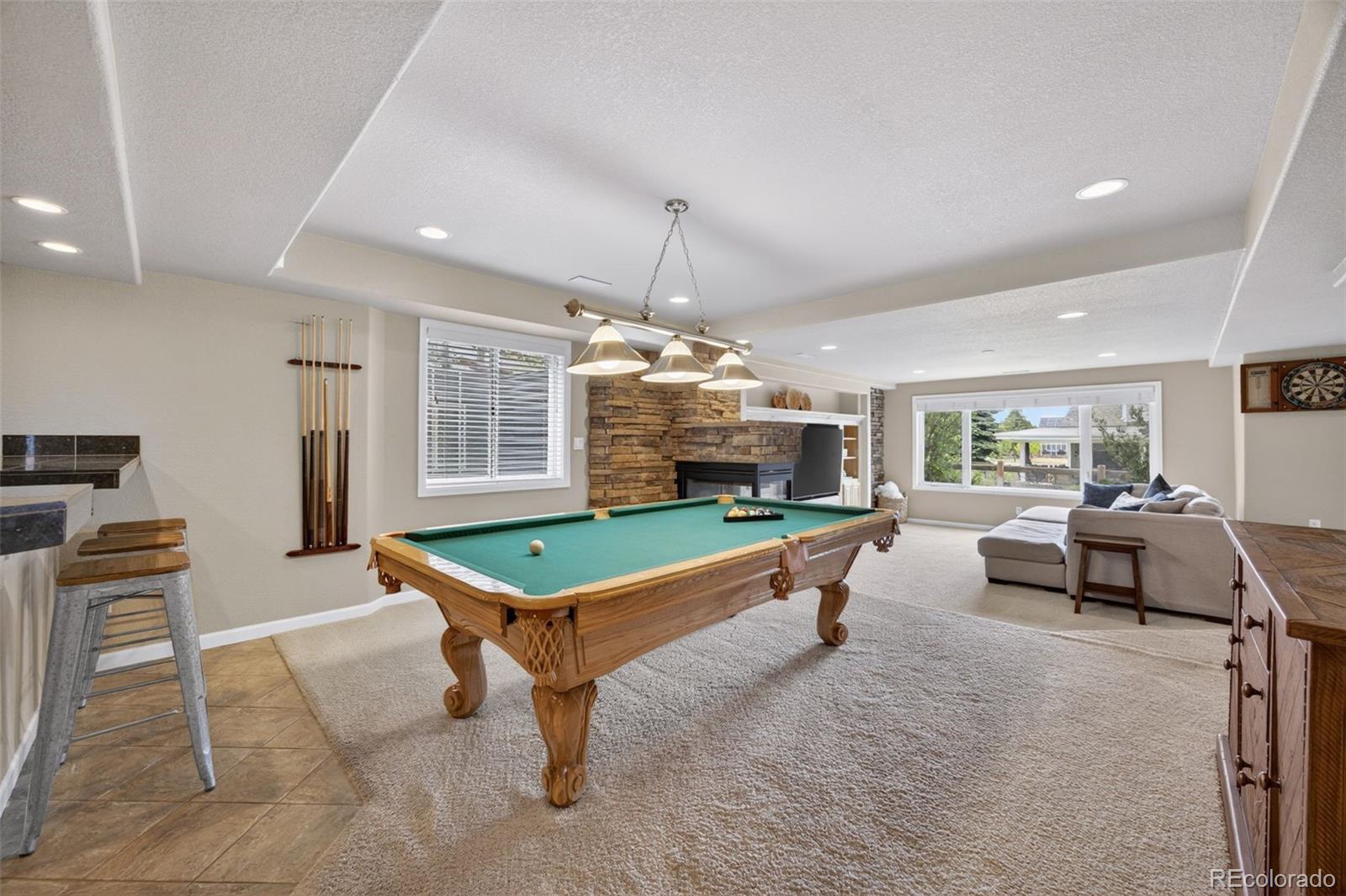 551 Seth Place Castle Pines, CO 80108 - Photo 32 of 50 a living room with furniture pool table and a window