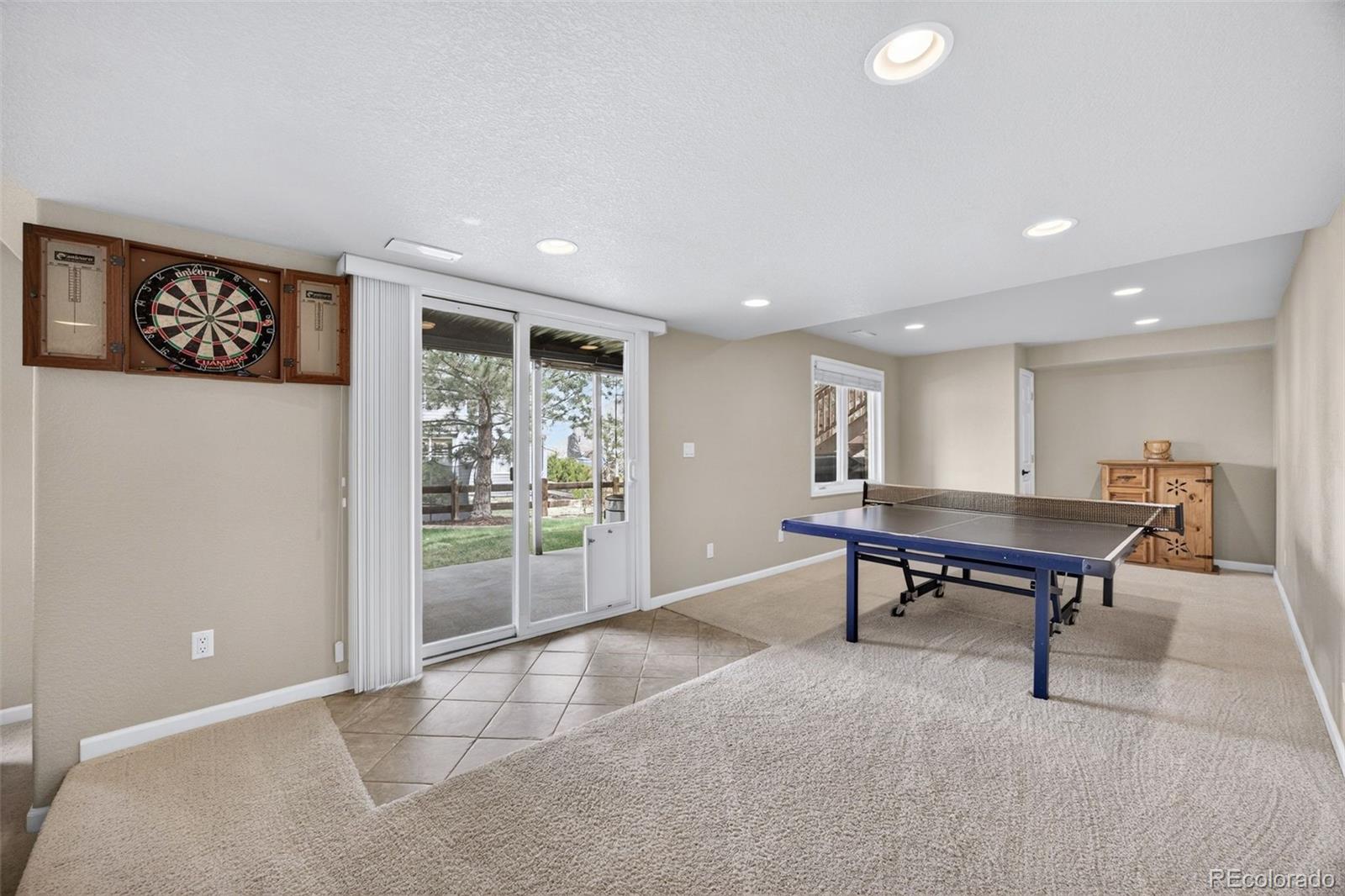 551 Seth Place Castle Pines, CO 80108 - Photo 36 of 50 a room with furniture and a gate