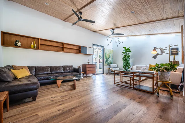 a bedroom with a bed a table and chair