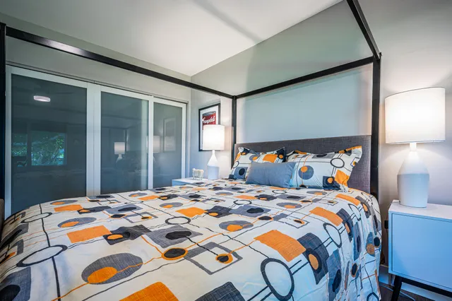 a view of living room with furniture and wooden floor