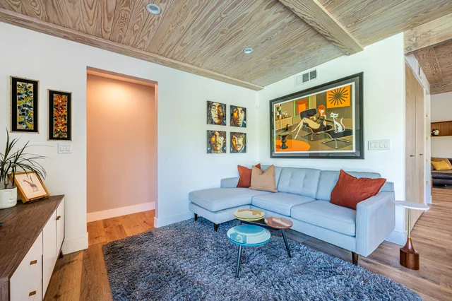 a view of a livingroom with furniture and a table