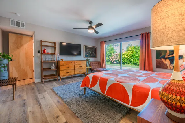 a dining area with a garden and outdoor seating