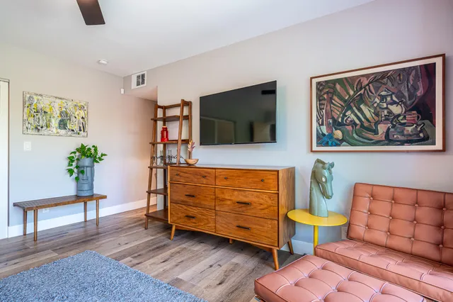 a front view of a house with a yard table and chairs