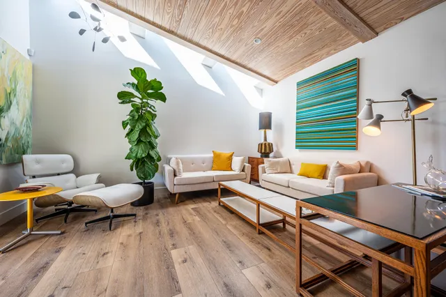 a bedroom with a bed and a couch