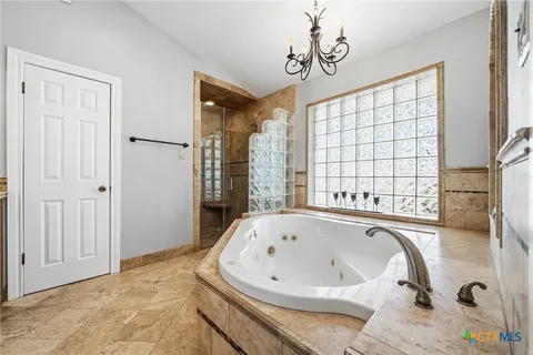 a bathroom with a bathtub and a shower