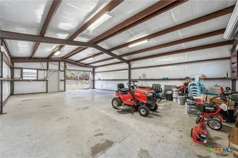 a view of dirt field with trees