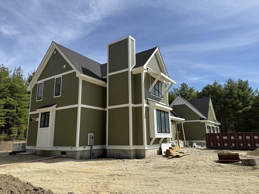 4 Orange Street, Unit LOT 11 Douglas, MA 01516 - Photo 2 of 15 a front view of a house with a yard