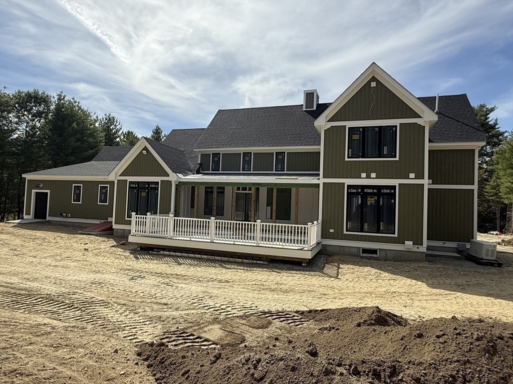 4 Orange Street, Unit LOT 11 Douglas, MA 01516 - Photo 3 of 15 a front view of a house with a yard