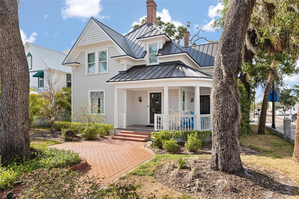 4 West Orange Street Tarpon Springs, FL 34689 - Photo 1 of 39 a front view of a house with a yard