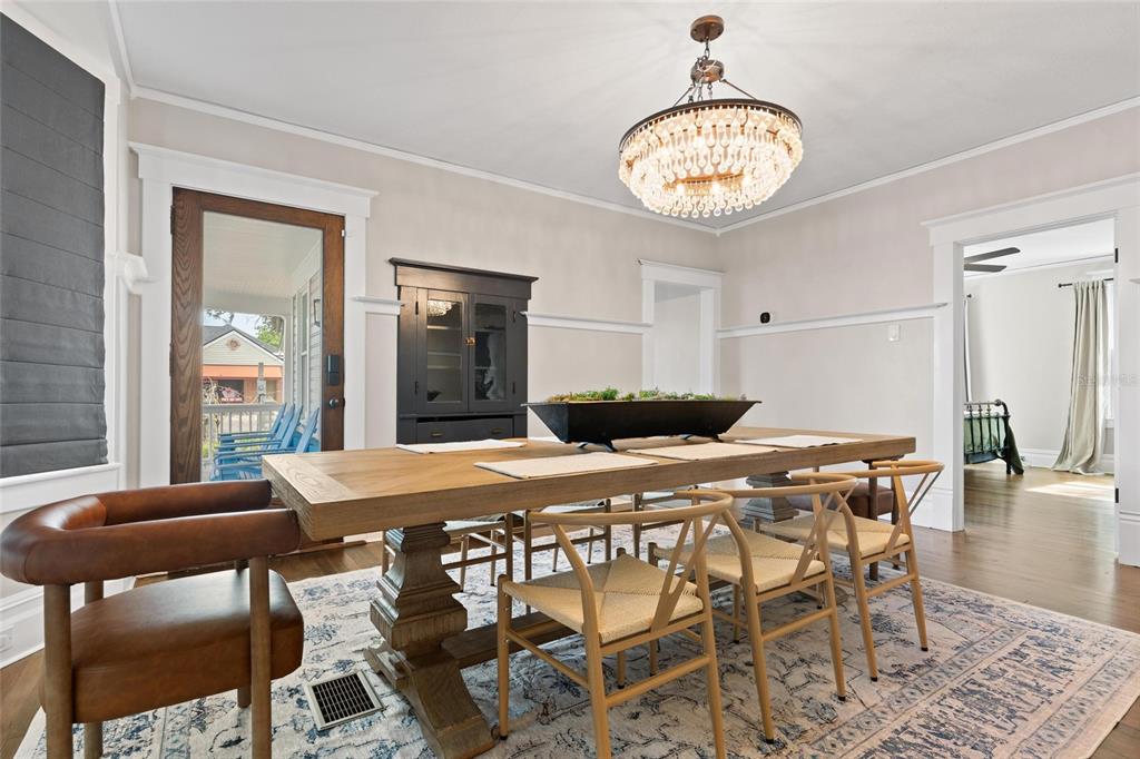 4 West Orange Street Tarpon Springs, FL 34689 - Photo 13 of 39 a view of a dining room with furniture and wooden floor