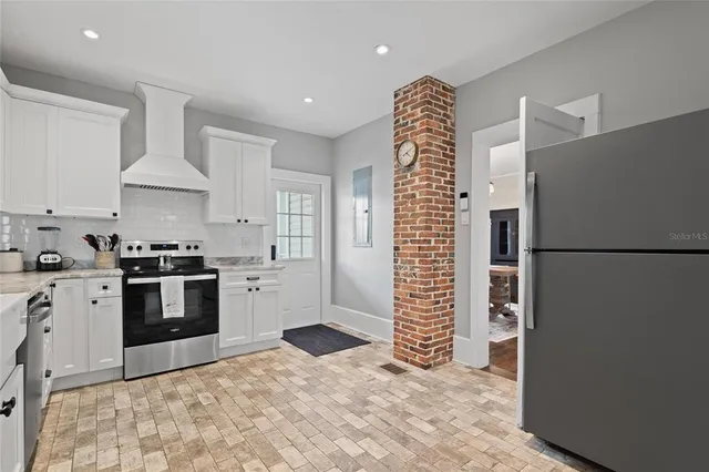 a bathroom with a sink a toilet a mirror and shower