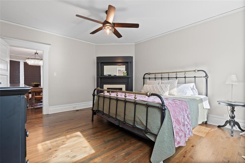 4 West Orange Street Tarpon Springs, FL 34689 - Photo 20 of 39 a bed room with a bed and a chandelier