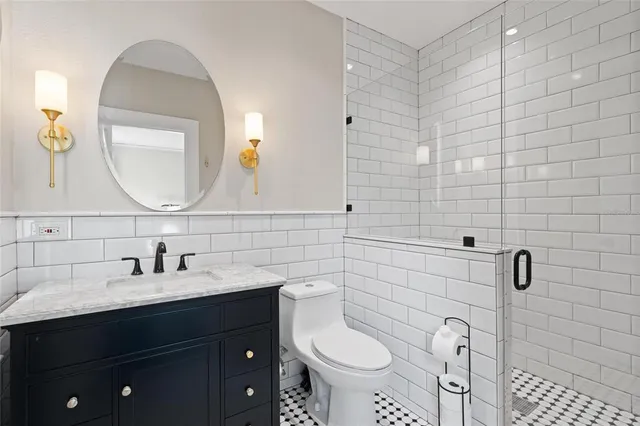 a view of a hallway with wooden floor and white walls