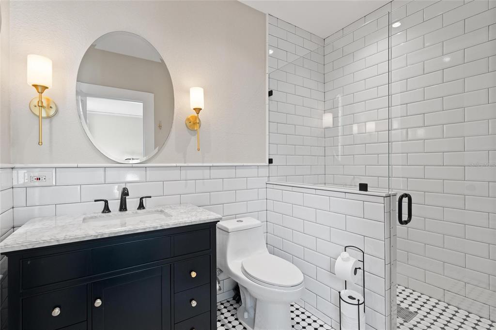 4 West Orange Street Tarpon Springs, FL 34689 - Photo 21 of 39 a bathroom with a sink and a mirror