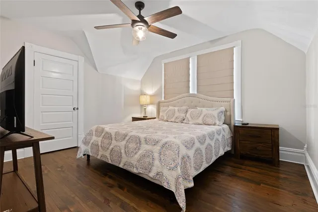 a bedroom with a bed and window