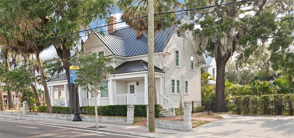 4 West Orange Street Tarpon Springs, FL 34689 - Photo 36 of 39 a front view of a building with street view