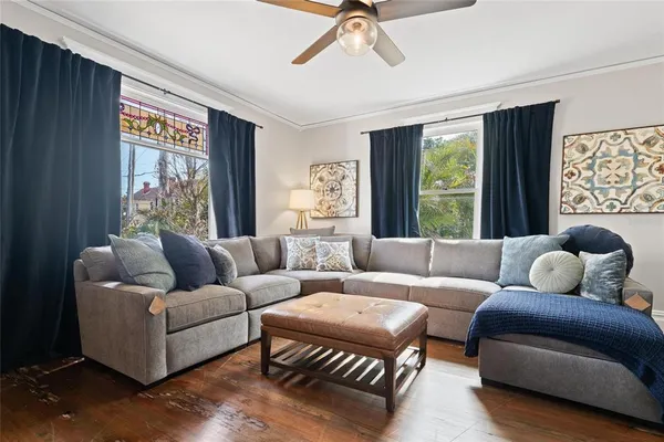 a living room with furniture and a large window