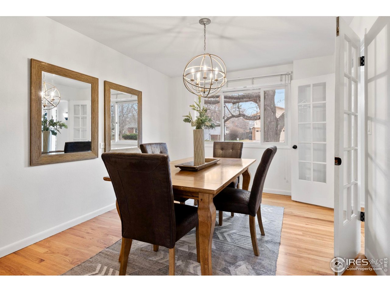 2900 Stanford Road Fort Collins, CO 80525 - Photo 11 of 50 Refreshed hardwood floors and french doors