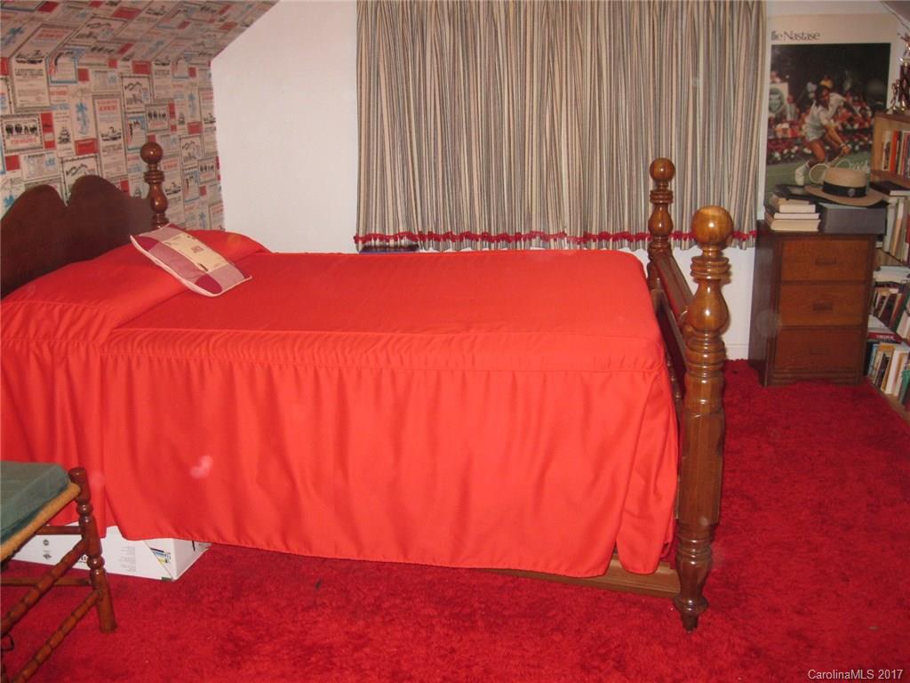 421 Fieldstone Road Mooresville, NC 28115 - Photo 12 of 18 a bed sitting in a bedroom next to a window