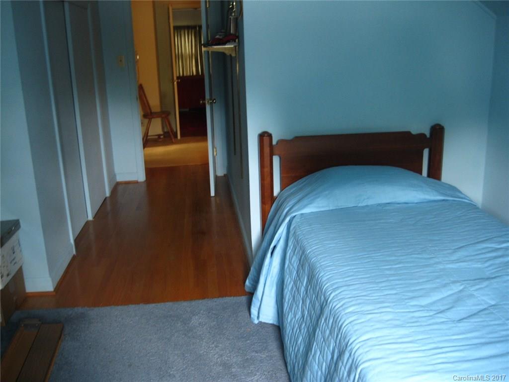 421 Fieldstone Road Mooresville, NC 28115 - Photo 13 of 18 a bedroom with a bed and a mirror