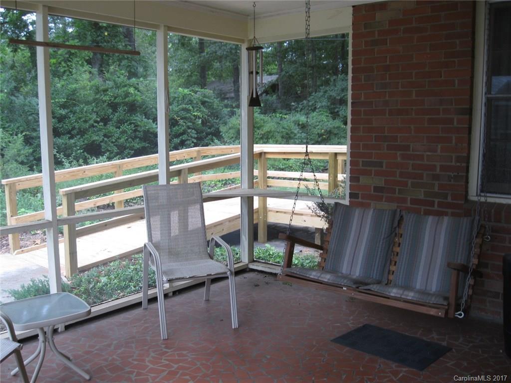 421 Fieldstone Road Mooresville, NC 28115 - Photo 15 of 18 a view of a porch with chairs and backyard