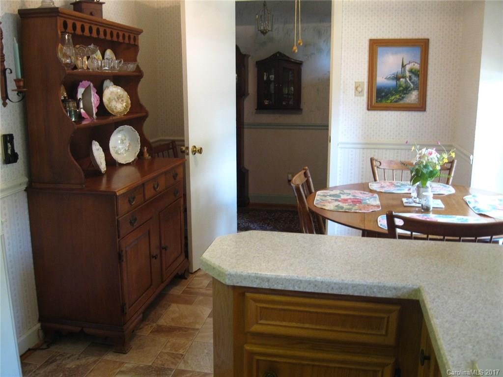 421 Fieldstone Road Mooresville, NC 28115 - Photo 4 of 18 a living room with furniture and a table