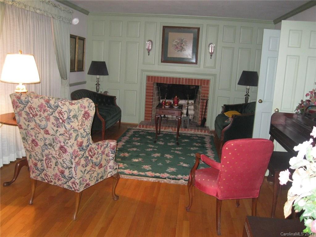 421 Fieldstone Road Mooresville, NC 28115 - Photo 6 of 18 a living room with furniture and a fireplace