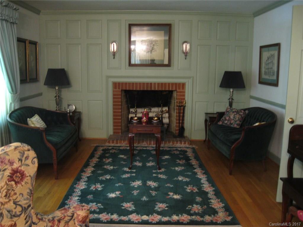 421 Fieldstone Road Mooresville, NC 28115 - Photo 7 of 18 a living room with furniture and a fireplace