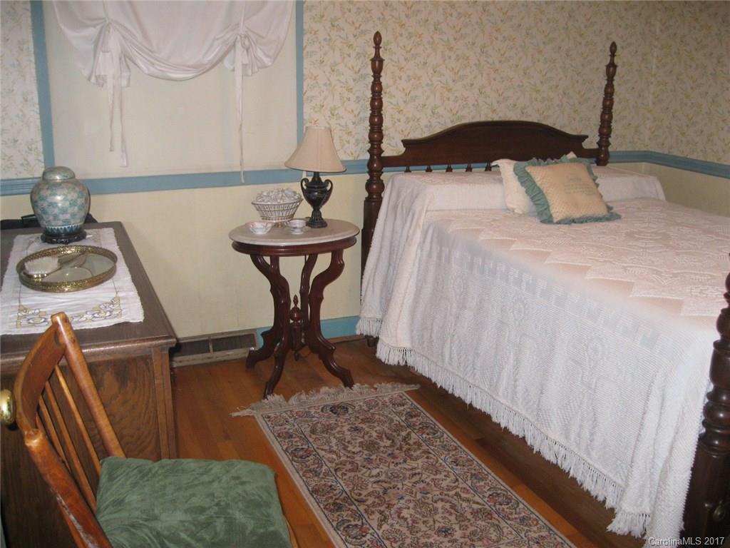421 Fieldstone Road Mooresville, NC 28115 - Photo 10 of 18 a bedroom with a bed and a dresser