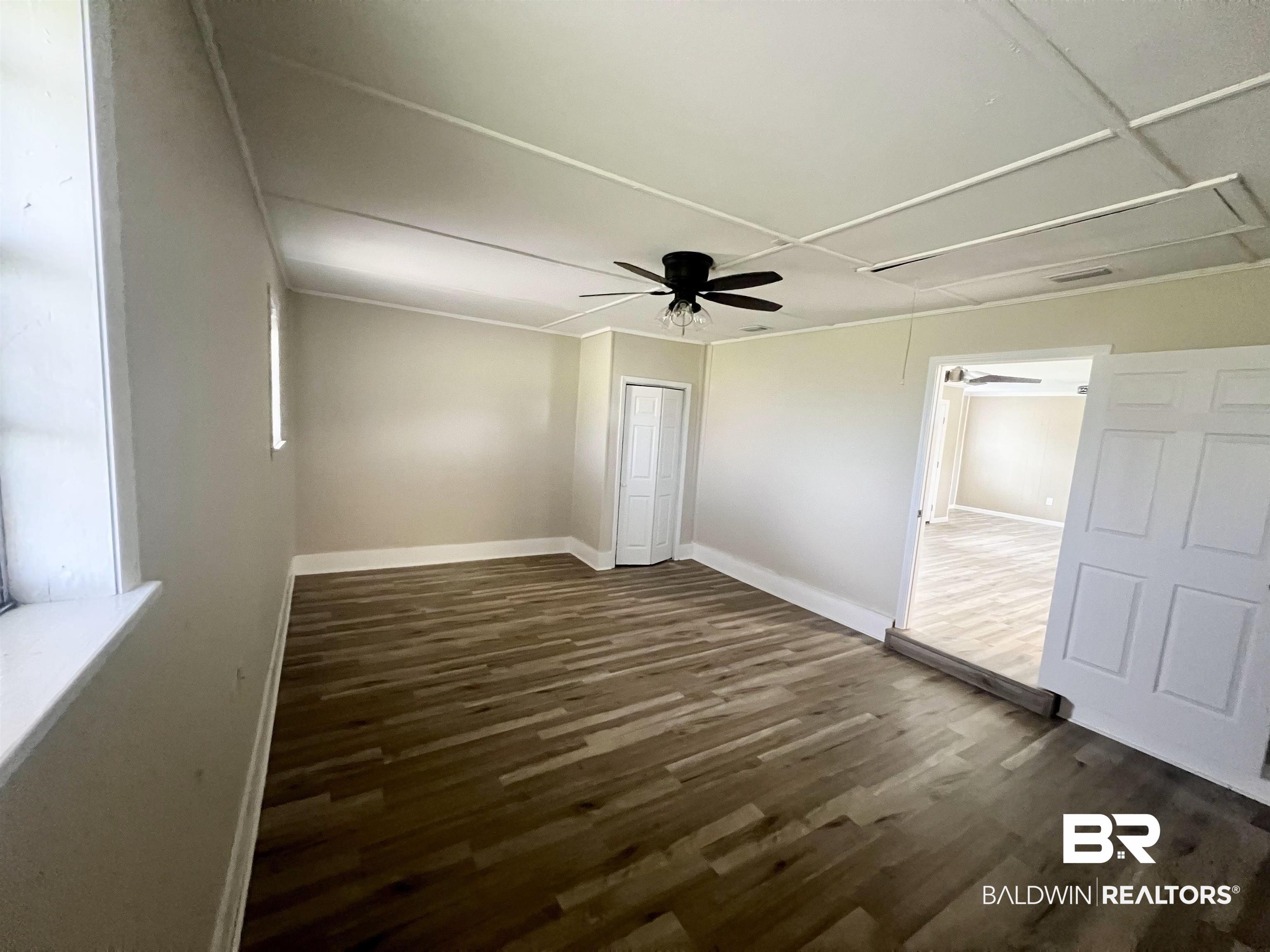 508 Freemanville Drive Atmore, AL 36502 - Photo 22 of 27 Interior space with ceiling fan and wood-type flooring