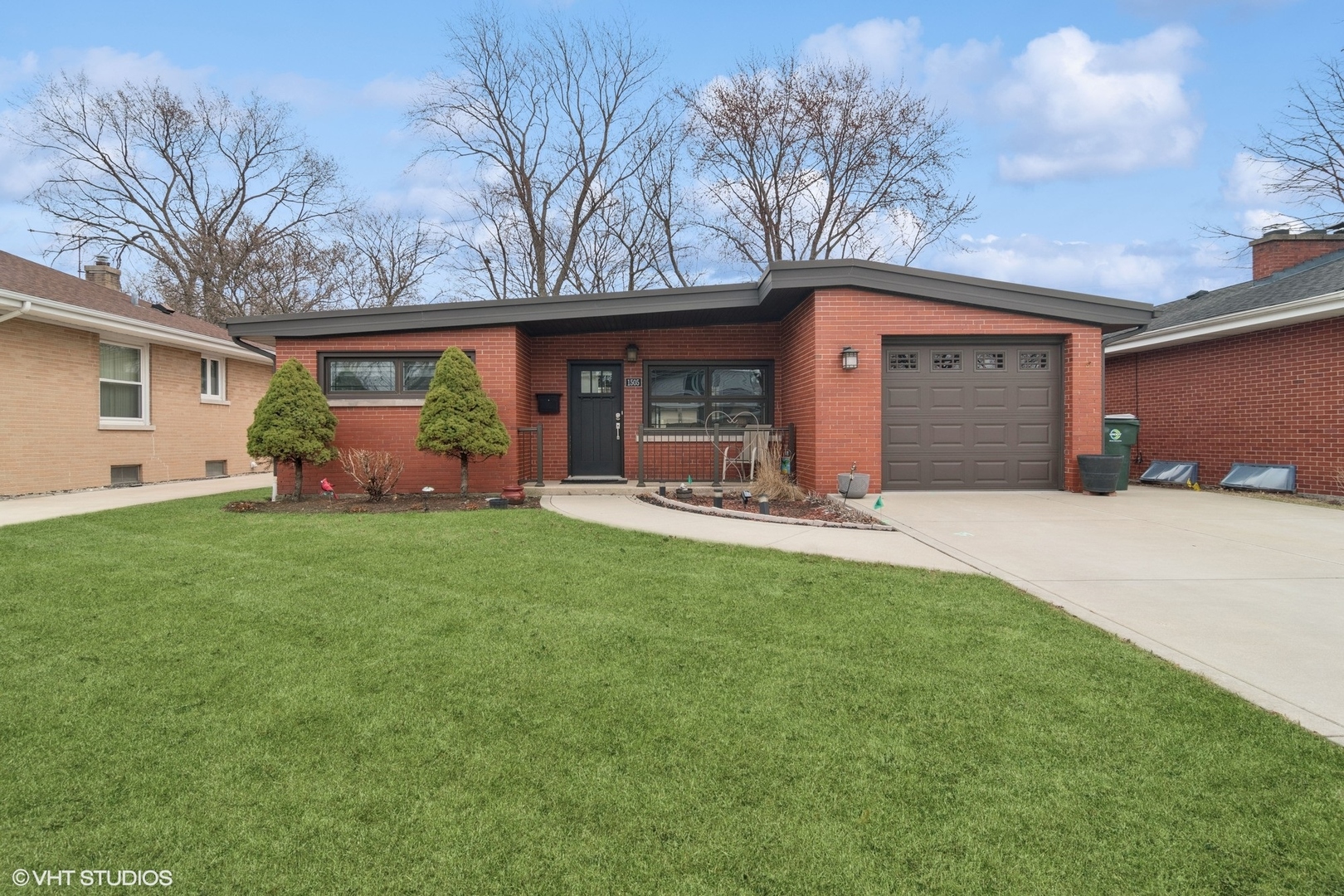 a front view of house with yard and outdoor seating